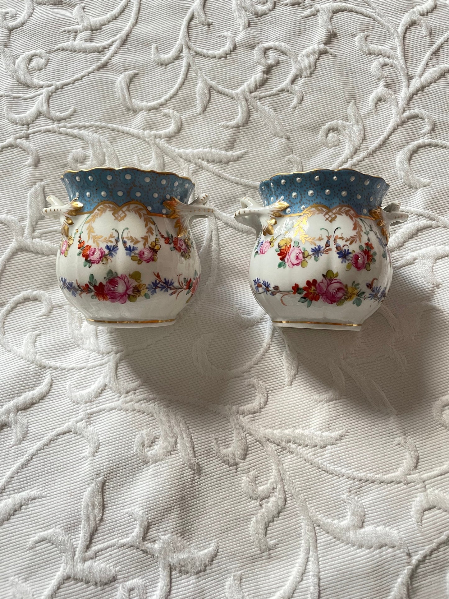 A Pair Of 19th Century Dresden Porcelain Two Handled Cache Pots Hand Painted And Encrusted With Flowers